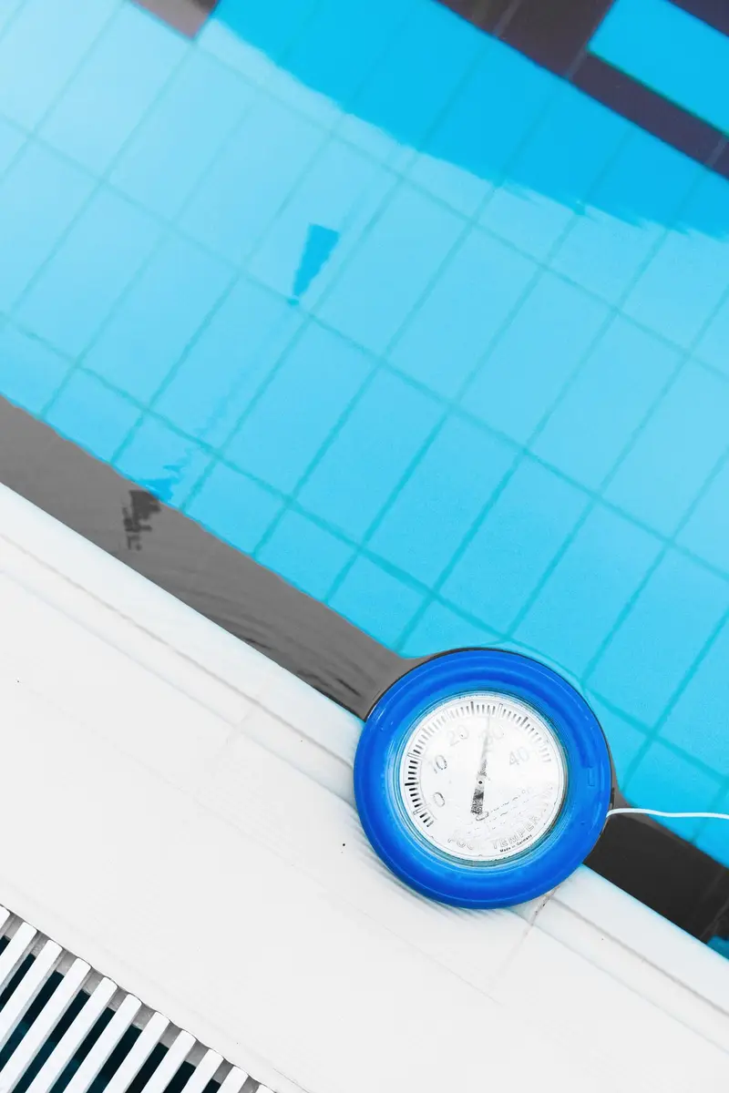Floating thermometer at the edge of a pool